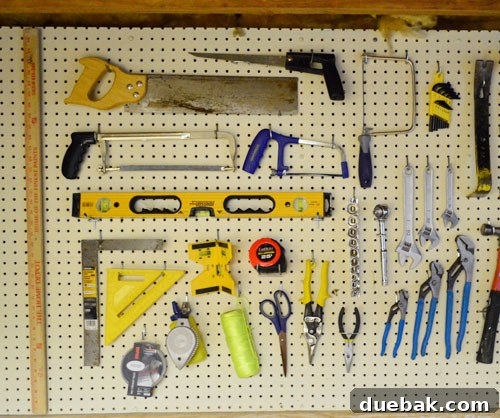 Maximize Tool Storage with a Pegboard 10 Close-up of pegboard with hand tools