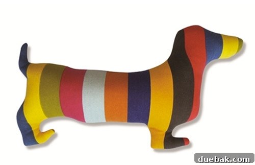 Painting the wooden duck with initial coat of colorful stripes