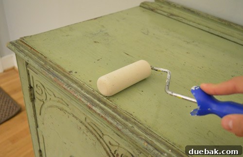 Perfectly Blending New and Existing Paint 12 Applying a clear sealer to the buffet with a foam roller