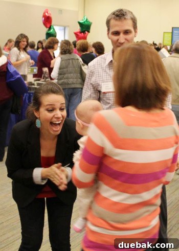 Sherry fawning over a child at book signing