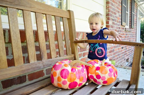 Three Playful Pumpkin Crafts for Little Ones 13 Clara singing to her pumpkins while sitting on a glider-bench