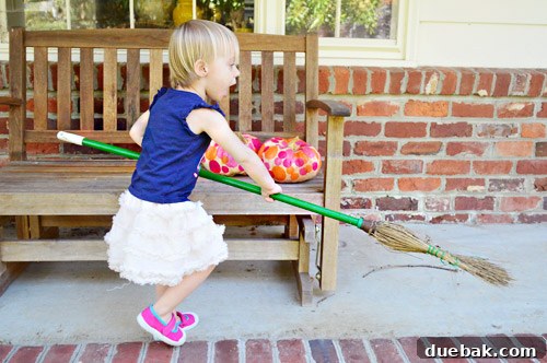 Three Playful Pumpkin Crafts for Little Ones 14 Clara enthusiastically sweeping the floor with a broom