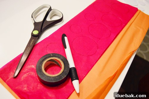 Three Playful Pumpkin Crafts for Little Ones 4 Sherry cutting tissue paper circles using electrical tape as a guide