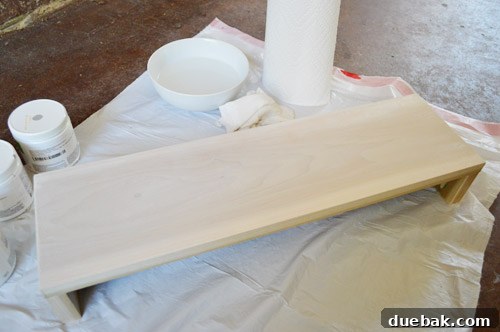 Shelf Your Tile Troubles: A DIY Cover-Up 10 Finished whitewashed floating shelf with visible wood grain.