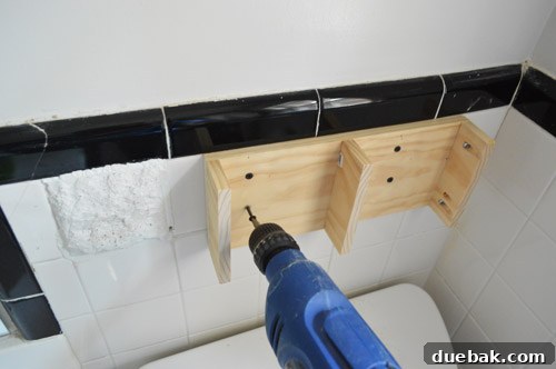 Shelf Your Tile Troubles: A DIY Cover-Up 5 Wooden 'sleeve' support structure for a floating shelf.