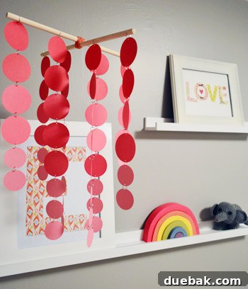 Whimsical homemade mobile hanging in a child's bedroom, adding playful charm