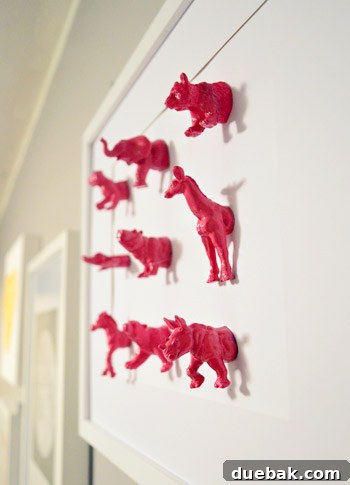 Charming plastic animal art mounted on small plaques, adding a whimsical touch to a child's room