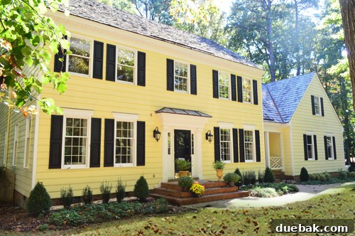Characterful Comforts: A Home's Warm Embrace 2 Charming Richmond Home Exterior with Tin Roof