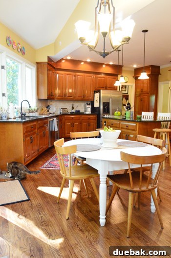 Characterful Comforts: A Home's Warm Embrace 7 Spacious Kitchen with Wood Cabinets and Dark Granite