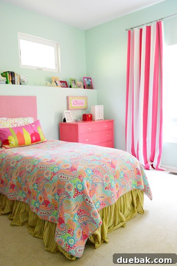 Roommates By Blood 9 Olivia's colorful room with bold curtains and upholstered headboard