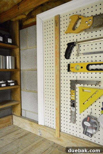 Close-up of framed pegboard edge