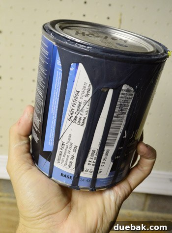 Hand holding a paint can, showing the selected Hale Navy color