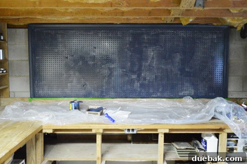 Large pegboard after two coats of Hale Navy paint, showing painted trim