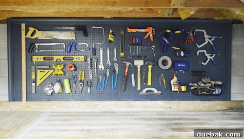 Tools re-hung on the freshly painted pegboard