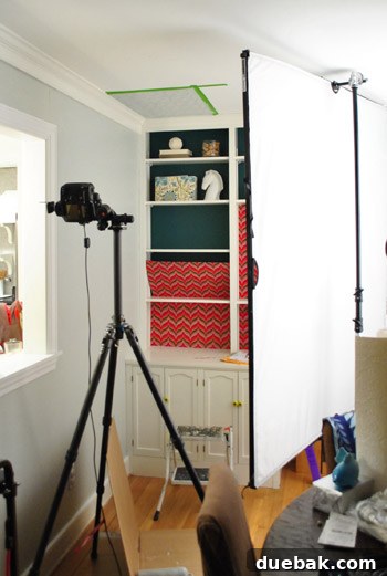 Temporary wallpaper on foam core taped to a ceiling for a DIY project photo.