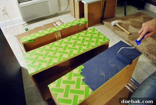 A wall painted with a basketweave pattern created using painter's tape.