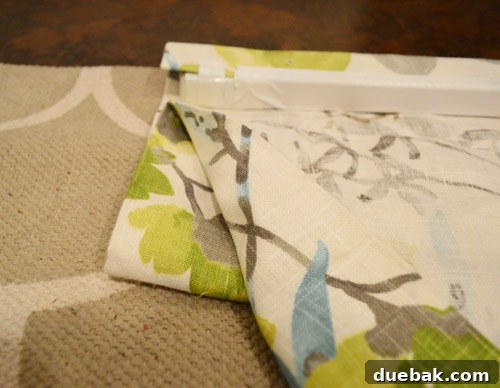 Creating fabric loops and pinning them from the back to form roman shade folds