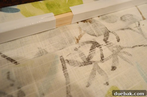 Close-up showing the placement of straight pins for creating subtle roman shade folds