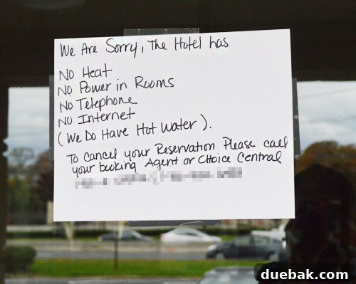A notice taped to a hotel door stating it's closed due to power outages from Hurricane Sandy