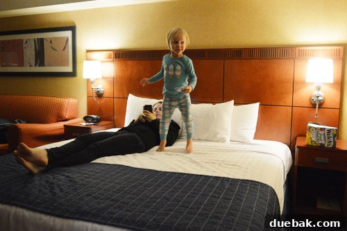 Clara, John and Sherry's daughter, sleeping soundly in a hotel room after a late arrival