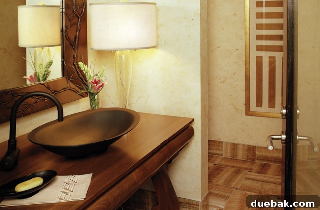 Modern bathroom vanity with a small vase of green foliage
