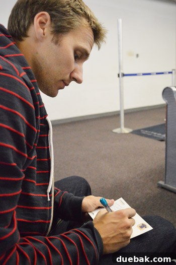 New York, Richmond, Chicago, Toronto: City Tapestry 22 John writing postcards to Granny at the airport gate