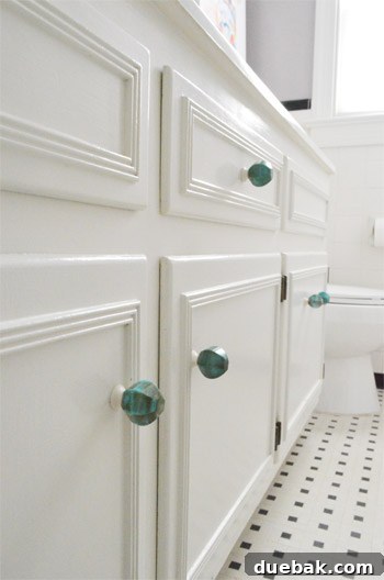 Elevate Your Windows with Frosting 6 Close-up of new green-jade-like knob on a white bathroom vanity, showing reflections