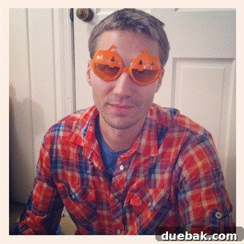 John wearing pumpkin sunglasses and smiling