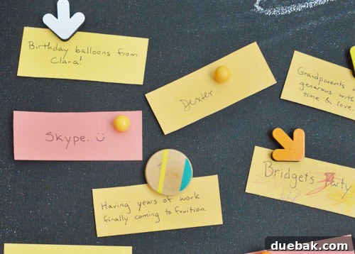 Crafting Your Thanksgiving Gratitude Board 8 Magnetic chalkboard with colorful Thanksgiving gratitude notes held up with fun magnets