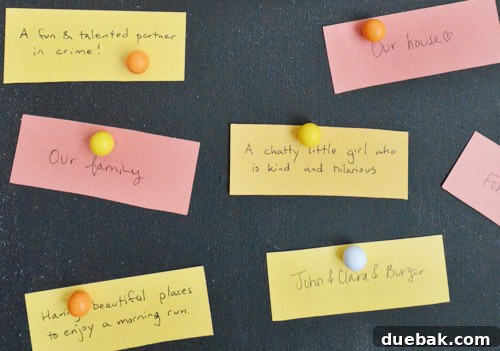 Crafting Your Thanksgiving Gratitude Board 10 Thanksgiving gratitude notes held to magnetic DIY chalkboard with round magnets
