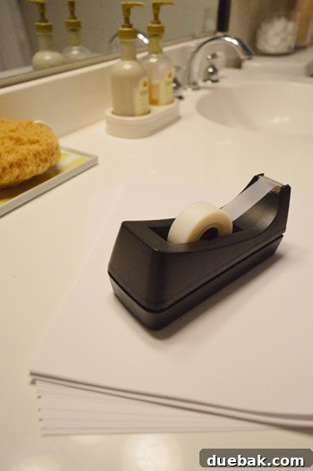 Instant Window Privacy: DIY Shades in Just 15 Minutes 3 tape dispenser and printer paper for window shade template