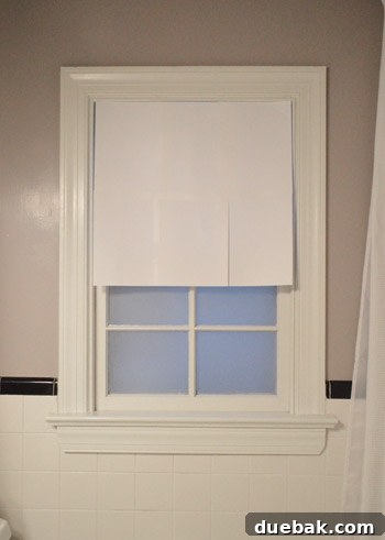 Instant Window Privacy: DIY Shades in Just 15 Minutes 4 pieces of paper taped together and hung on window