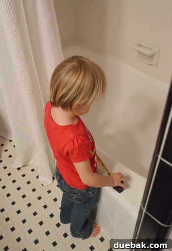 Instant Window Privacy: DIY Shades in Just 15 Minutes 9 young girl playing with tape measure