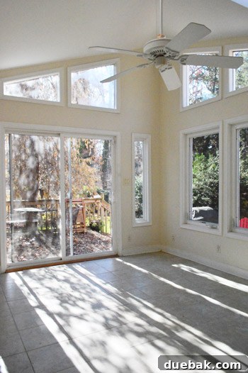 The sunroom completely cleared of all items, a true blank slate ready for the next phase of renovation, showcasing its empty dimensions.