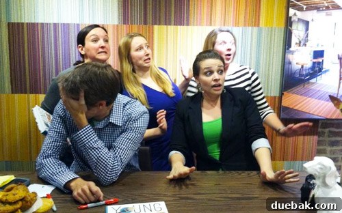 Authors striking a 'scared' pose for a humorous photo request at a book event.