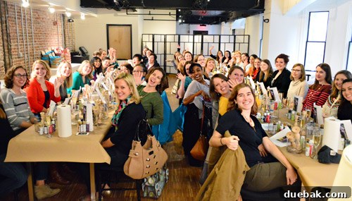 Participants eagerly engaging in a crafting workshop led by the authors at LivingSocial.