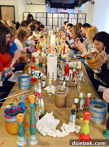 Sherry Petersik demonstrating a crafting technique during a workshop.