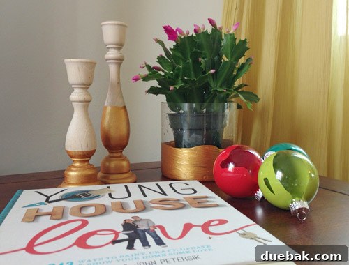 Three finished crafting projects from a workshop participant: ornaments, a hurricane vase, and candlesticks.