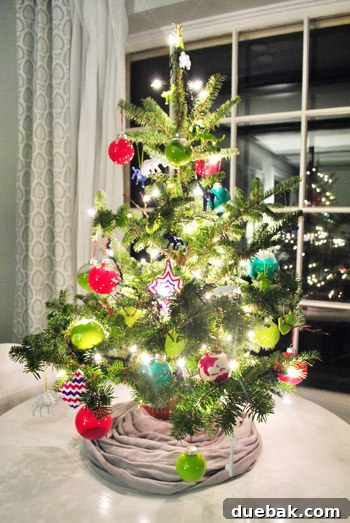 Small Homemade Ornaments On Colorful Tabletop Christmas Tree