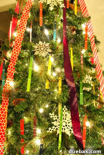 Detail Of Paint Chip Holiday Cut Out Christmas Ornaments on Tree