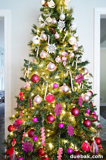 Christmas Tree Decorated with White, Silver, Pink, Purple, and Red Gradient Ornaments