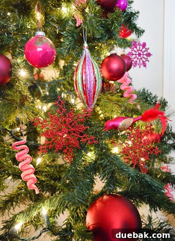 Detail of Red and Purple Ornaments on Gradient Christmas Tree Design