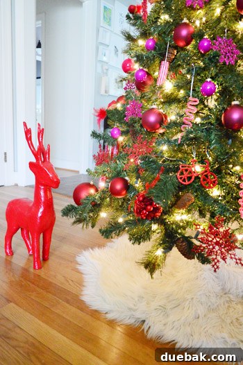 Red Reindeer Decoration At Bottom Of Gradient Christmas Tree