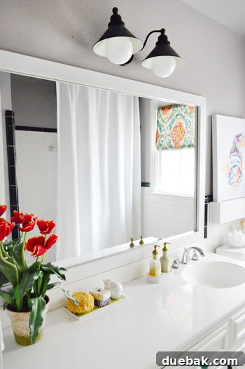 Finished DIY framed mirror in the bathroom