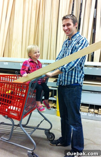 Cutting wood pieces for the mirror frame with a miter saw