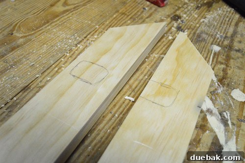Marking notches on the wood frame for mirror clips