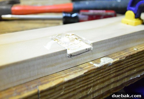 Close-up of the finished, rough-hewn notch on the mirror frame