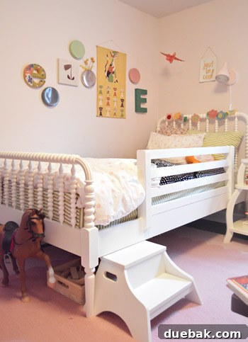 House Transformation: Finally Home 14 Eleanor's stylish pink bedroom with Land Of Nod bedding and 'Just Be Cool' banner