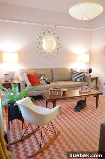 House Transformation: Finally Home 3 Elegant living room with Astor Pink walls by Benjamin Moore