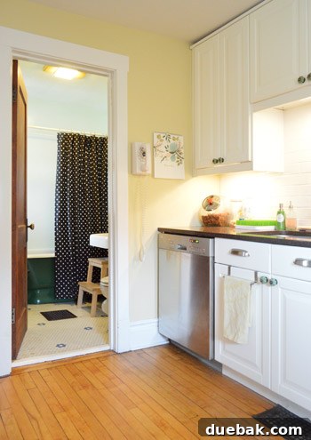 House Transformation: Finally Home 8 Vintage green tub in a charming unexpected bathroom